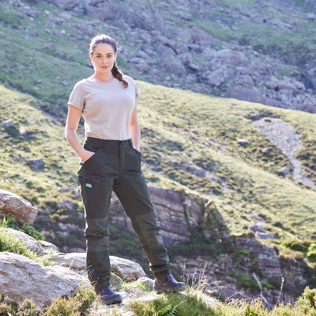 Person wearing outdoor clothing on a mountainous landscape