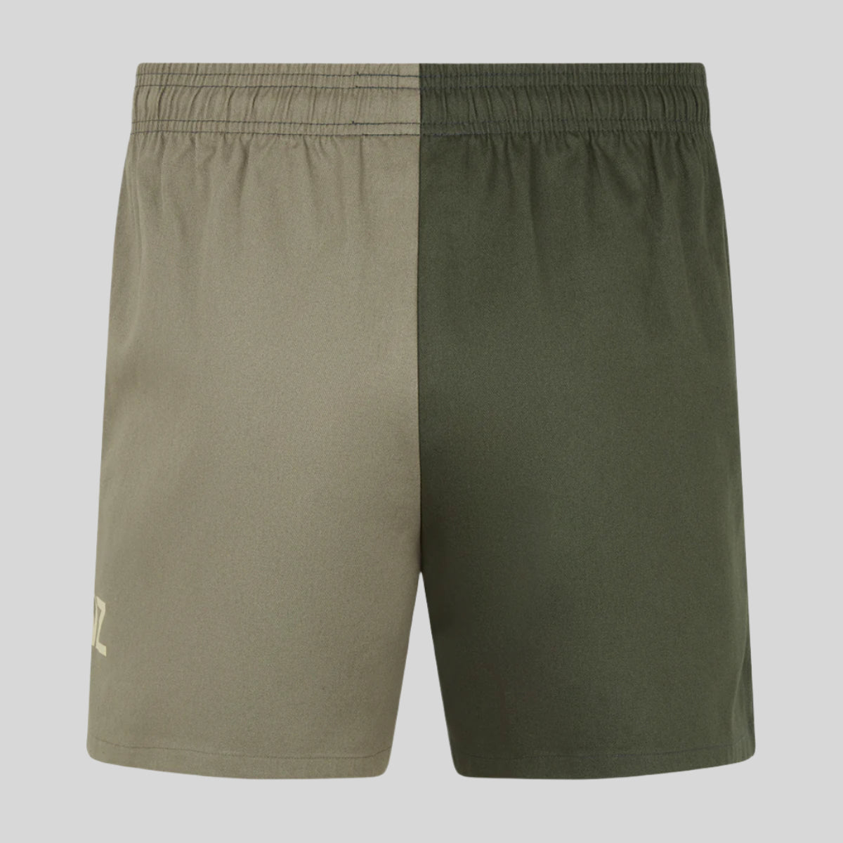 A pair of men's rugby shorts back with a combination of beige and cream colours,