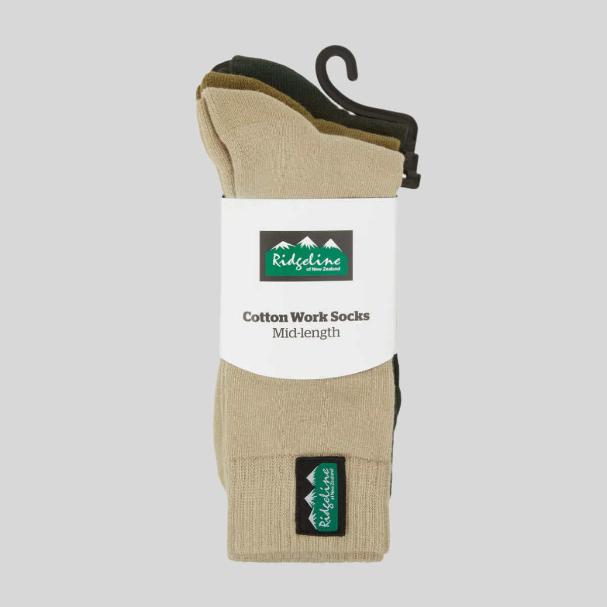 Beige socks on a hanger with Ridgeline branding on a white background