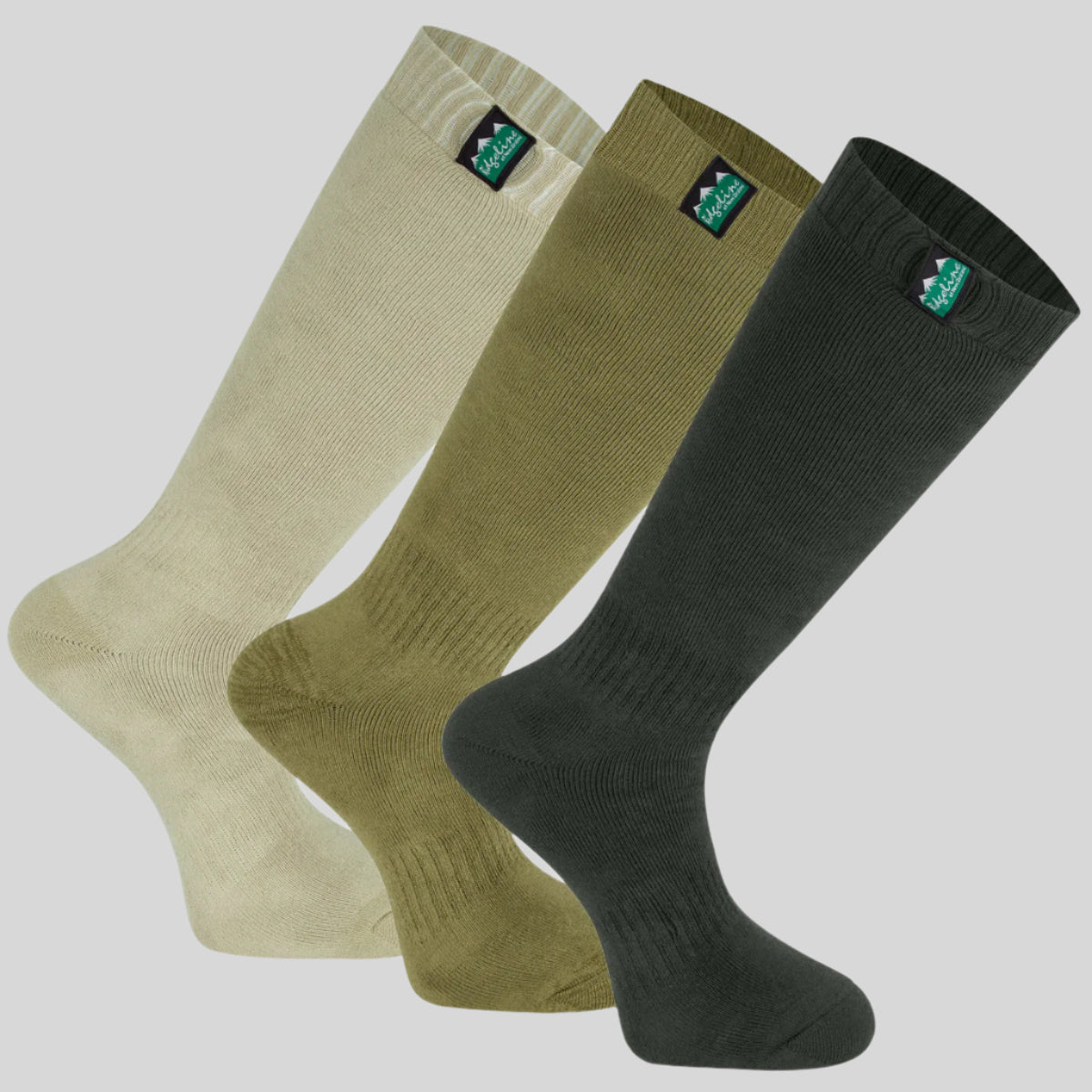 A pack of three full-length work socks in beige, green, and olive colours, displayed against a white background.
