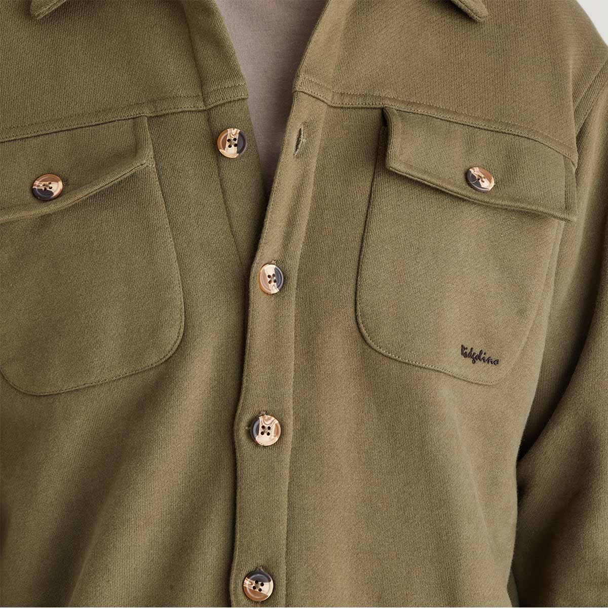 Close-up of a green jacket with button details and a visible brand logo.