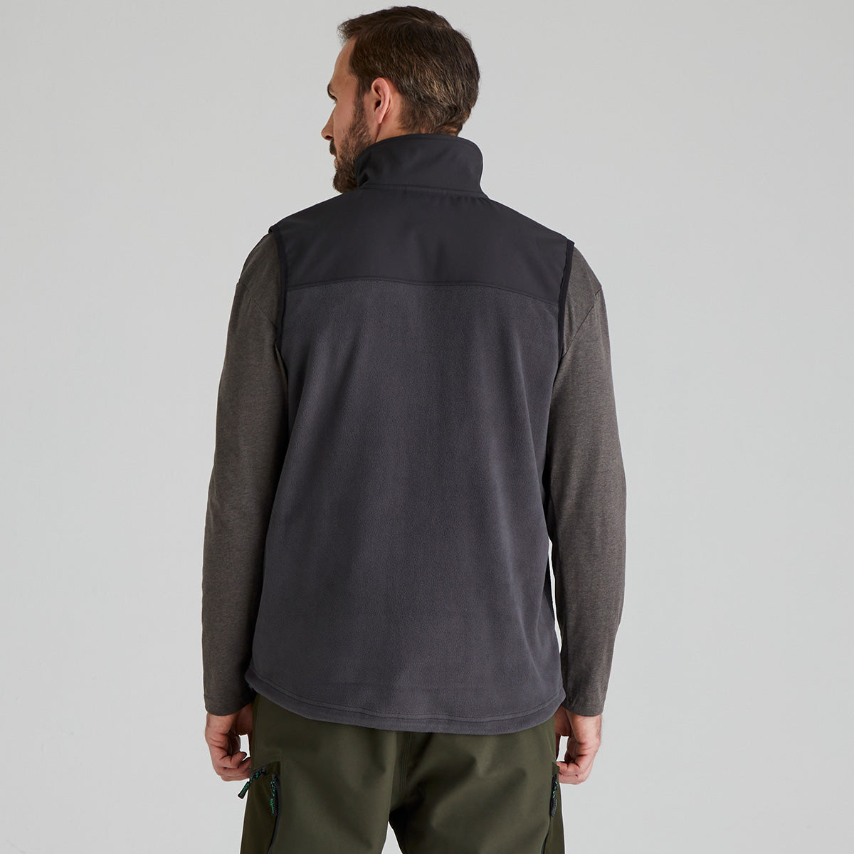 back view of Man wearing a grey fleece jacket on a light grey background