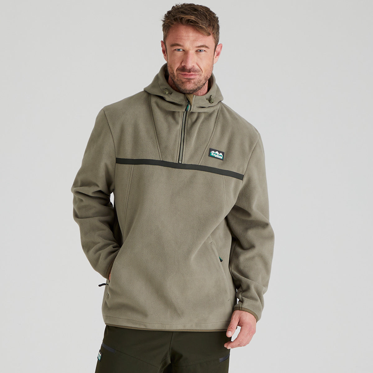 Man wearing green fleece smock with Ridgeline Clothing Logo