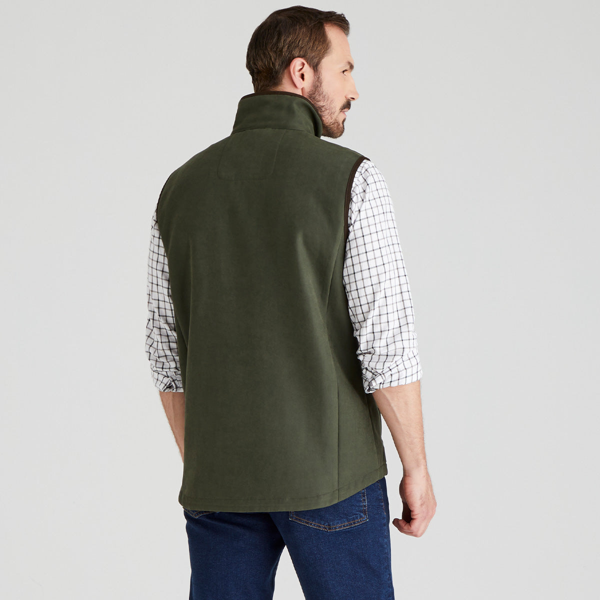 back view of Man wearing Green windproof gilet with checked shirt