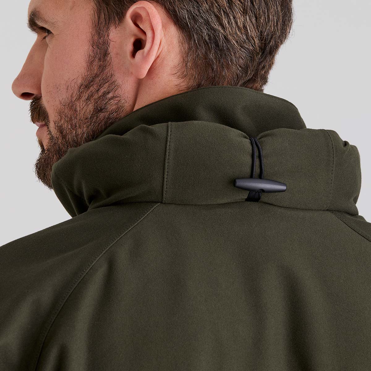 close-up of fold away hood of the collar on a light gray background