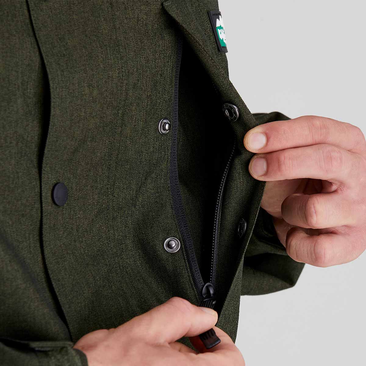 close up of hidden chest pocket with zip