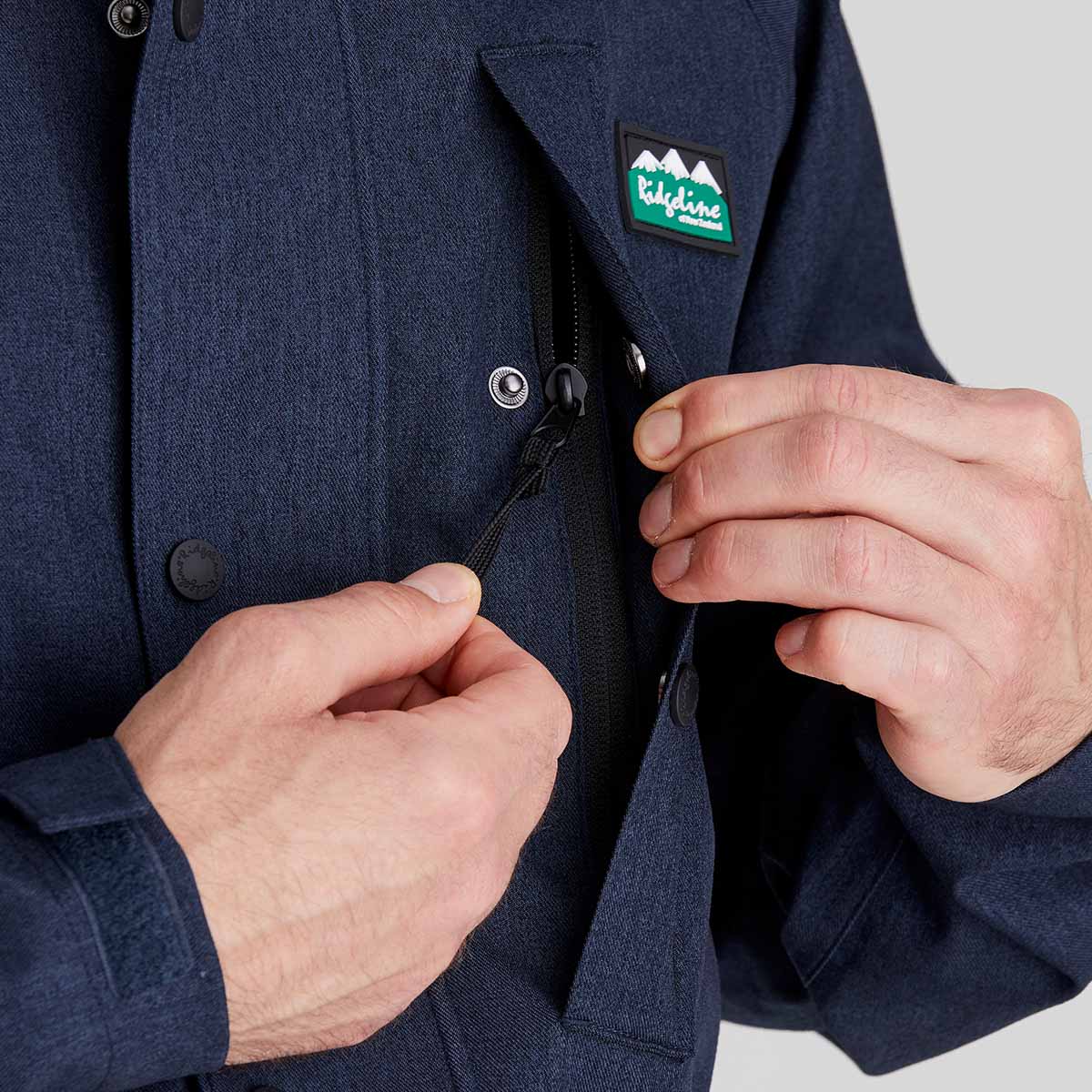 close up of hidden chest pocket with zip