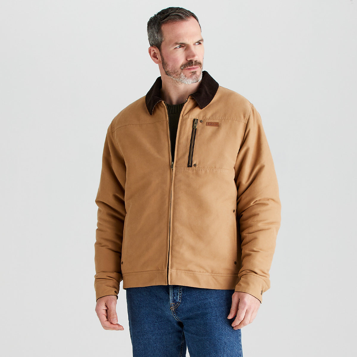 Man wearing a brown jacket on a light gray background