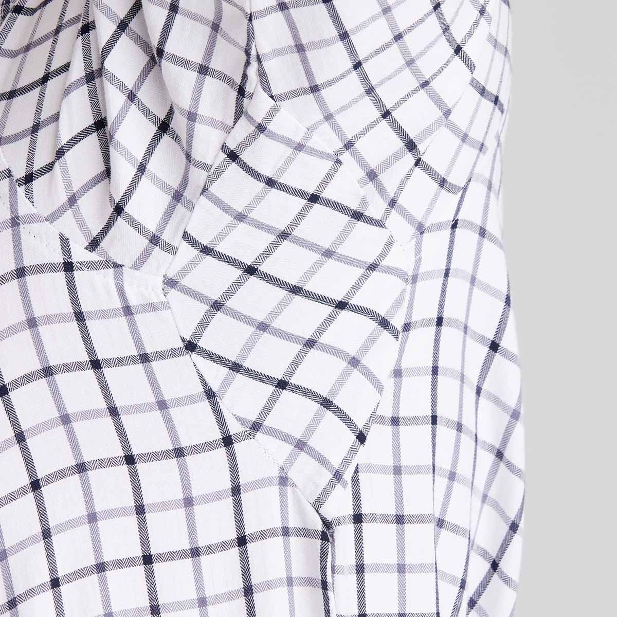 White fabric with black checkered pattern on a plain background
