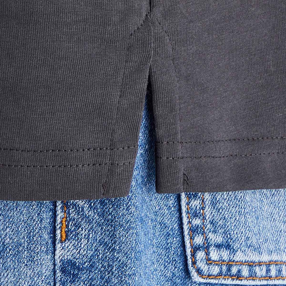 Man wearing two tone rugby shirt with grey background