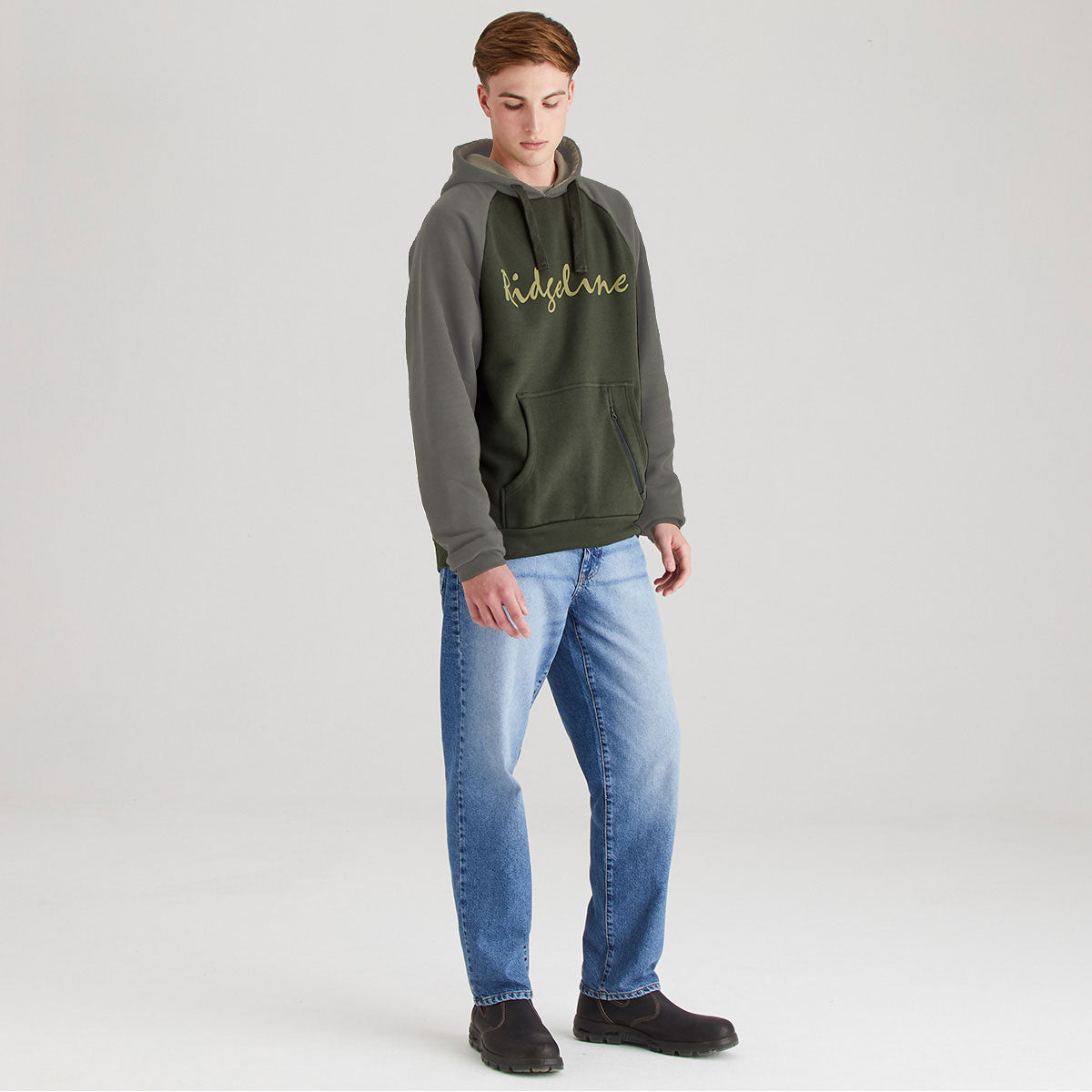 Olive green and grey raglan hoodie with embroidered Ridgeline script logo, kangaroo pocket and zip pocket detail, shown in full-length angled front view.
