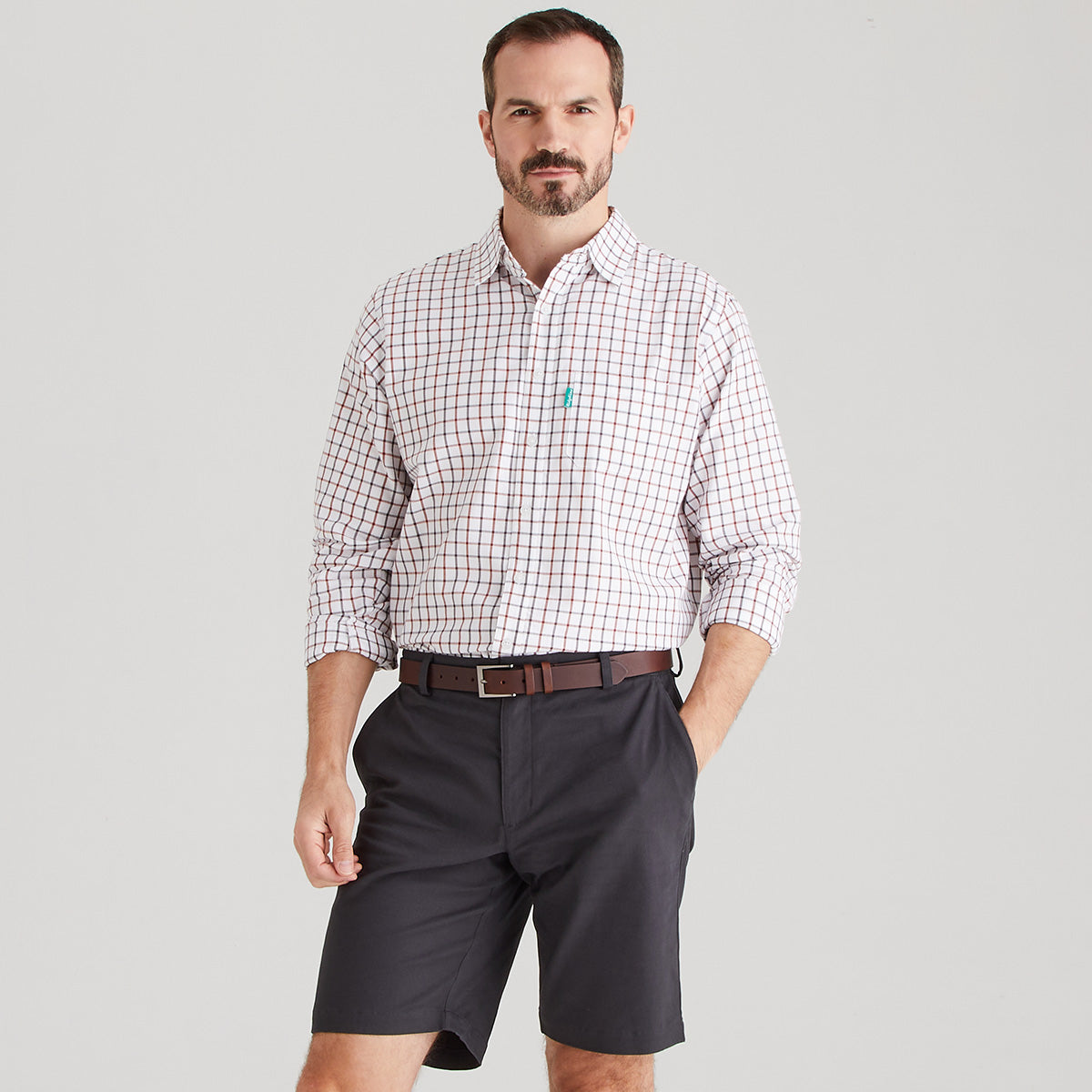 Man wearing shorts with checkered shirt