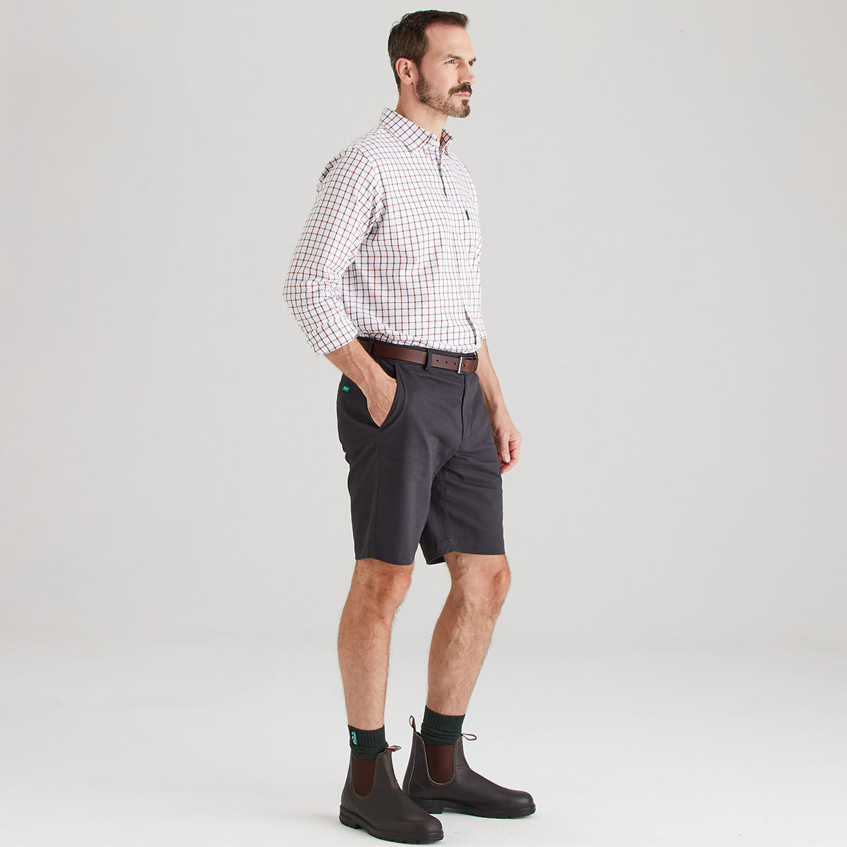 Man wearing shorts with checkered shirt