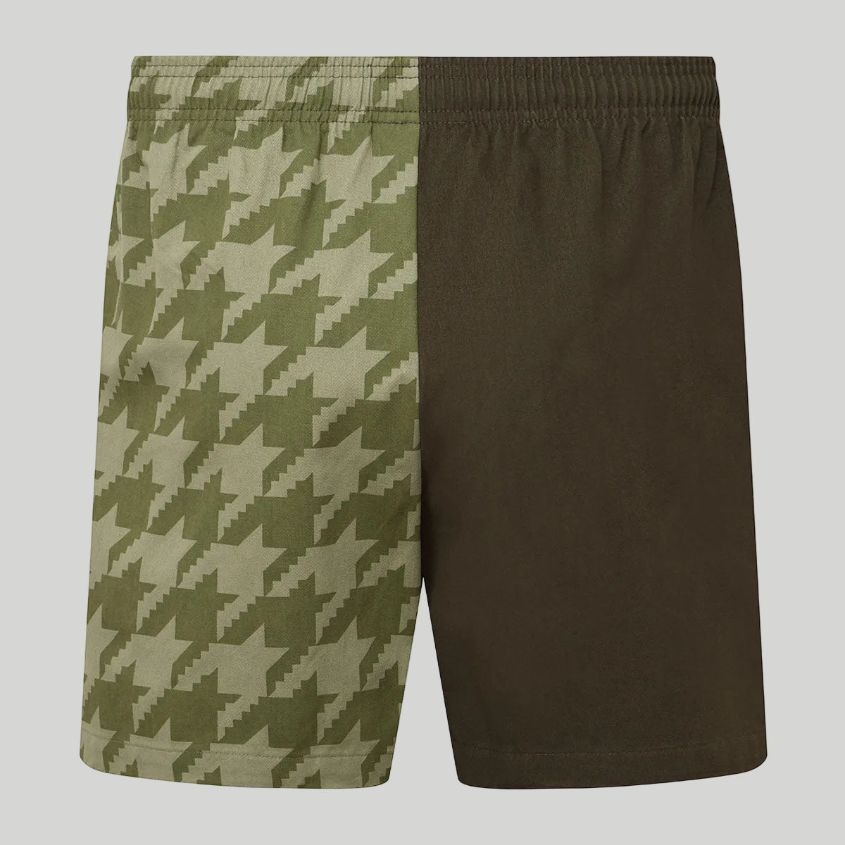 shorts with two patterns, one with a houndstooth pattern and the other solid green, on a white background.