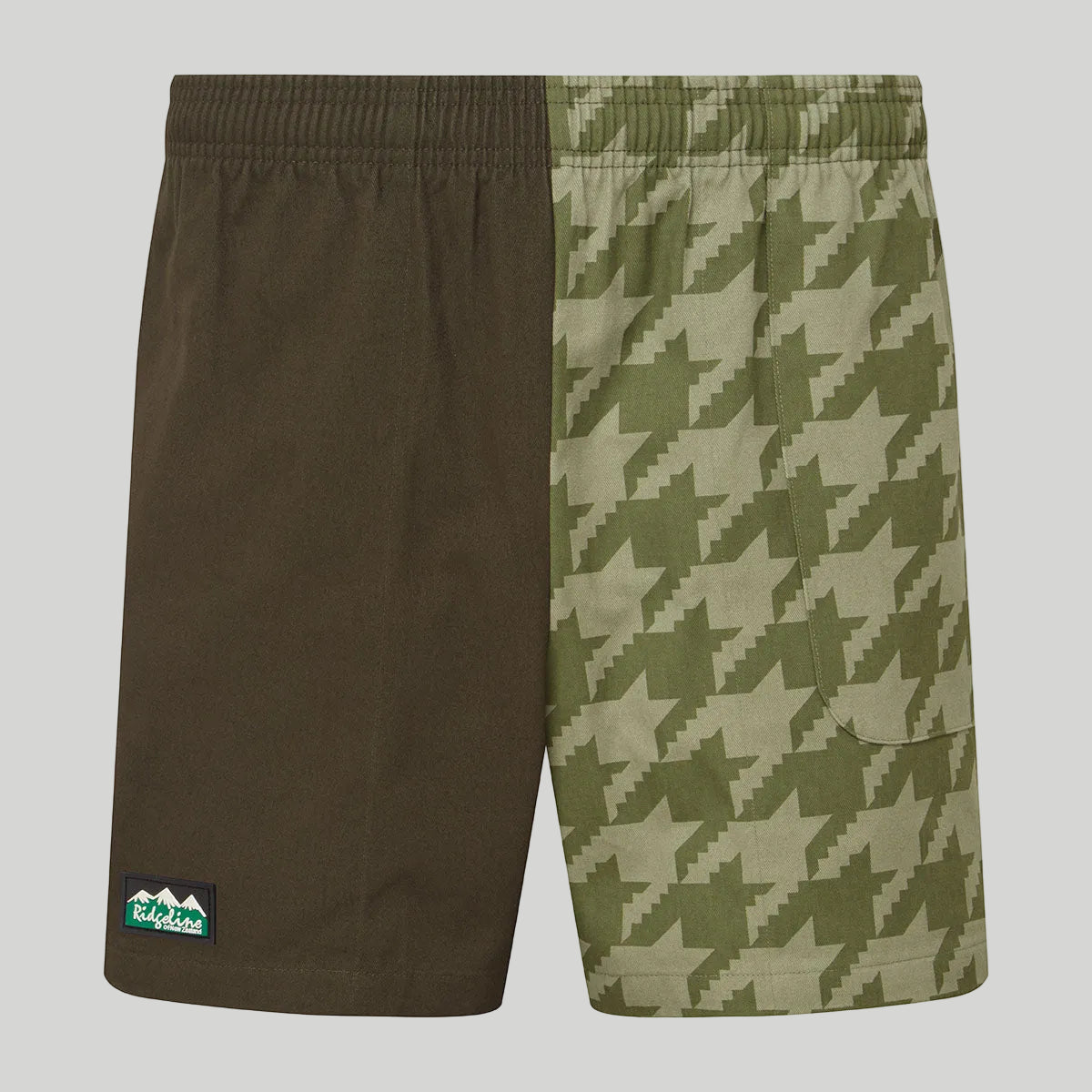shorts with two patterns, one with a houndstooth pattern and the other solid green, on a white background.