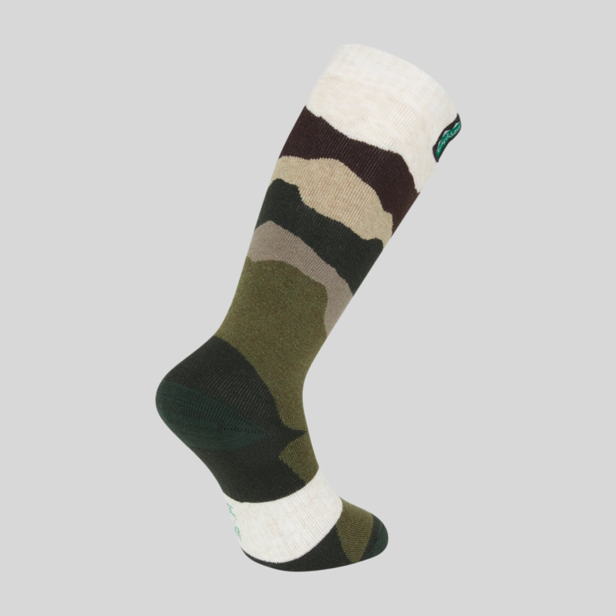 A camouflage patterned full-length merino wool sock with a visible Ridgeline Clothing brand logo.