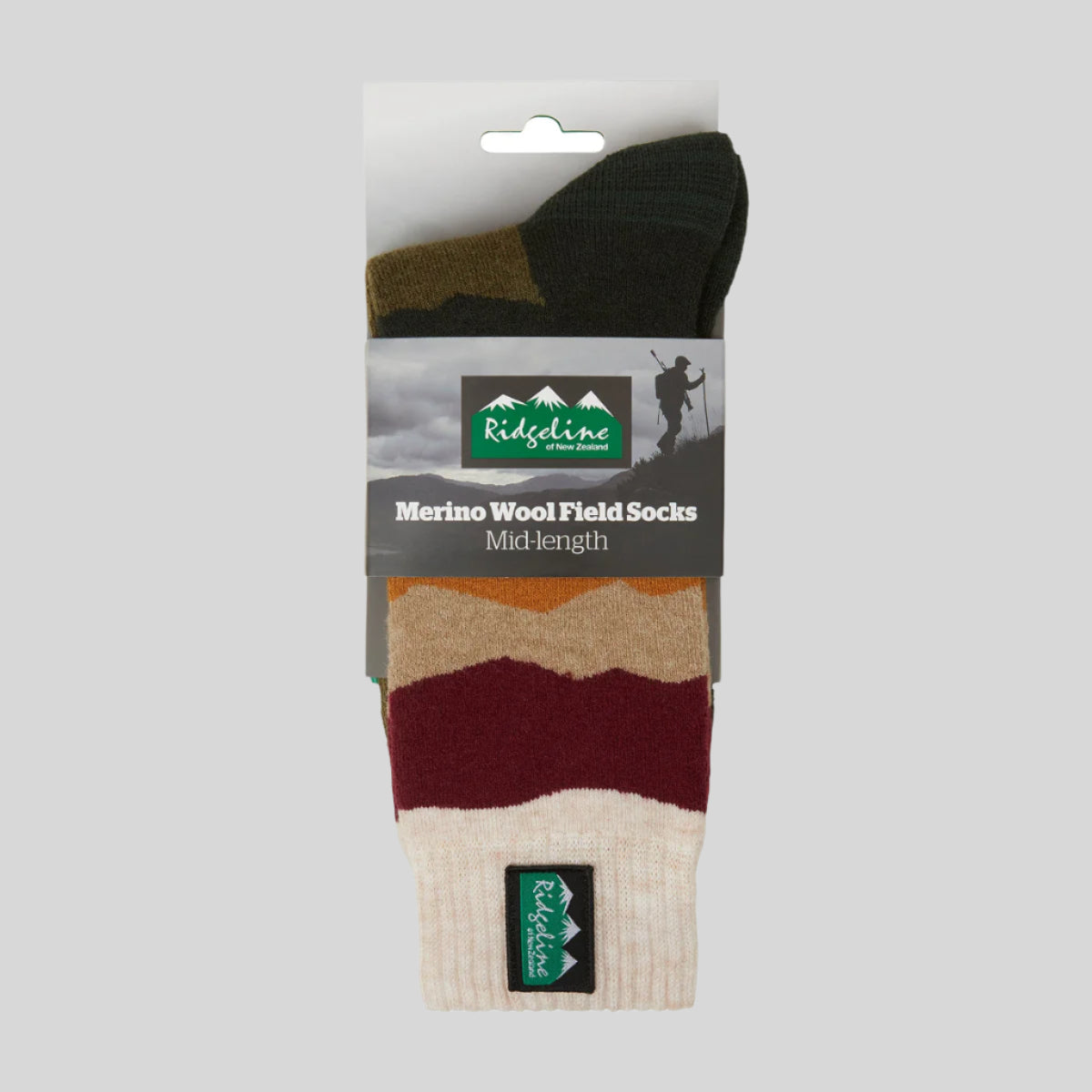 Packaged green and brown striped socks with Ridgeline branding on a white background