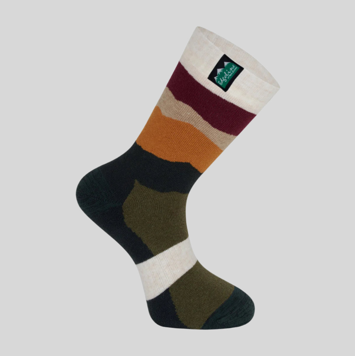 A mid-length merino wool sock with a striped pattern in multiple colours, including green, beige, and red, featuring a brand tag on the cuff. with a white background