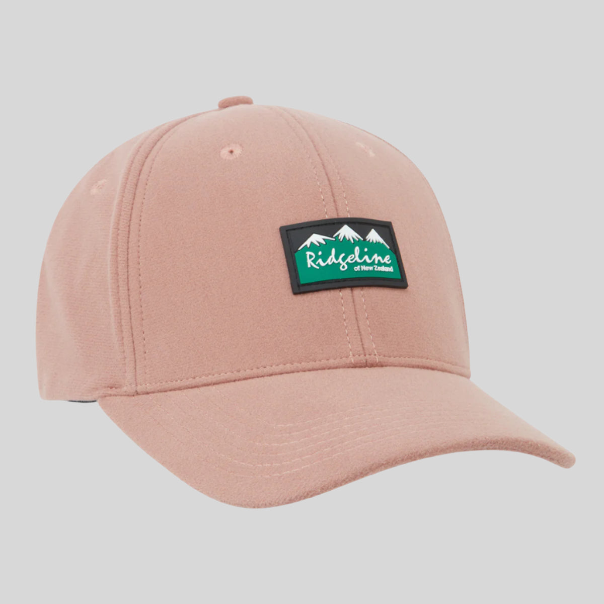 Pink cap with a green and black Ridgeline Clothing logo on a white background