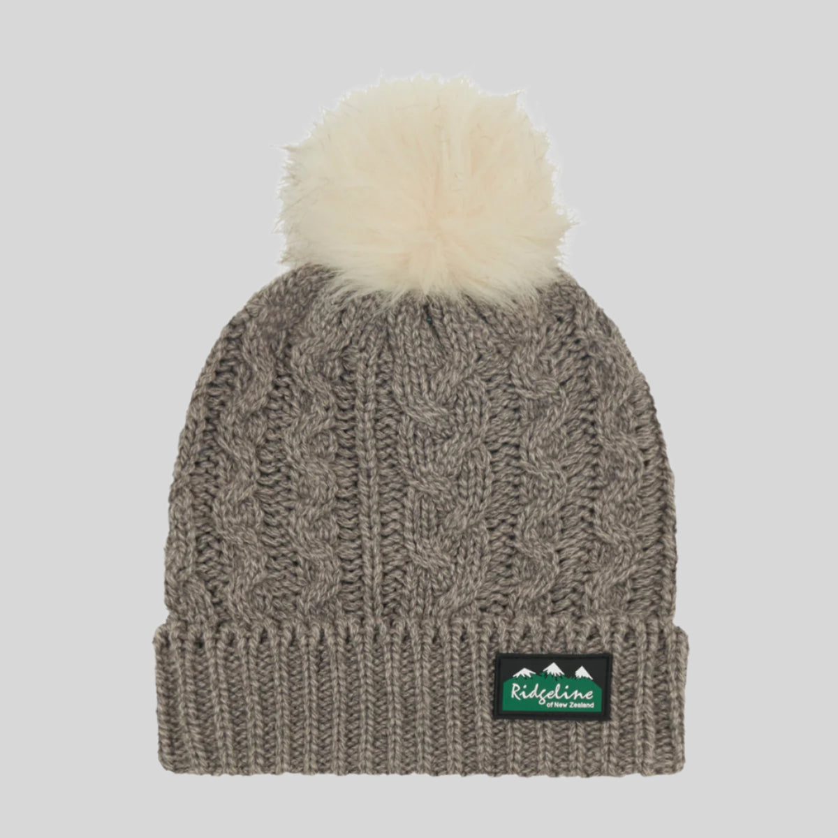A grey Nordic Fleck bobble hat with a white pom-pom on top and a wide rib turn-up band. on a white background