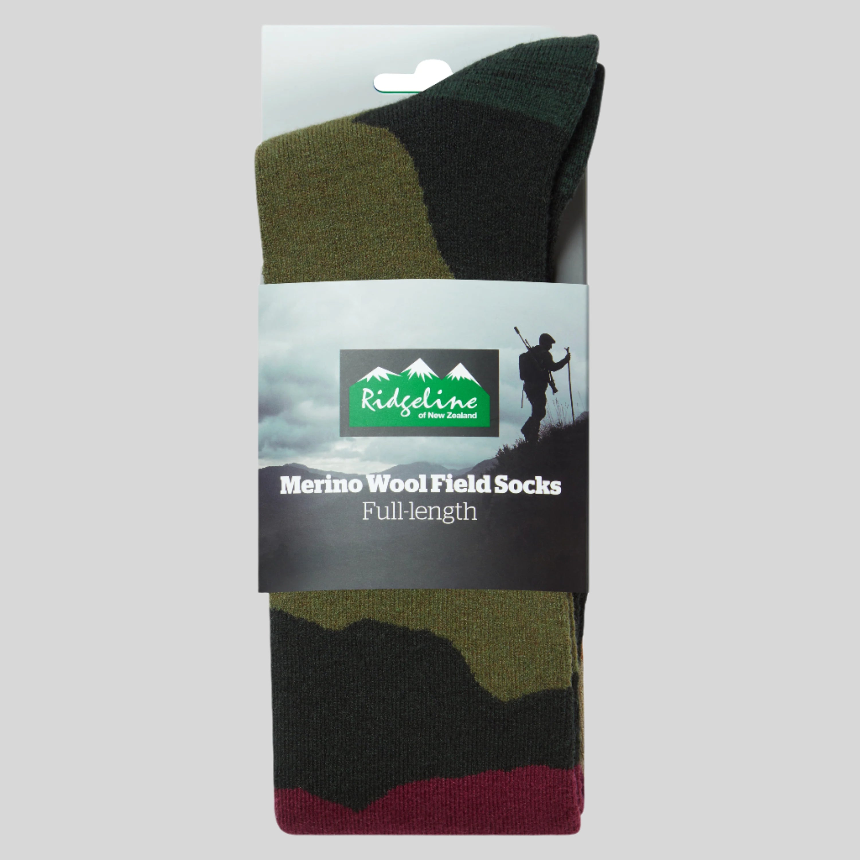 Packaged merino wool field socks with a visible brand label on a white background