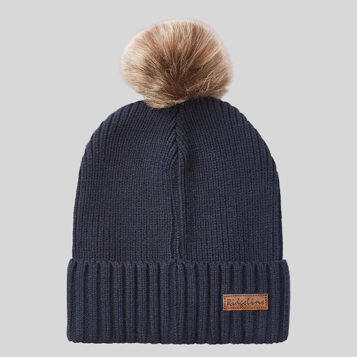 Navy ribbed knit beanie hat with faux fur pom pom, front view.