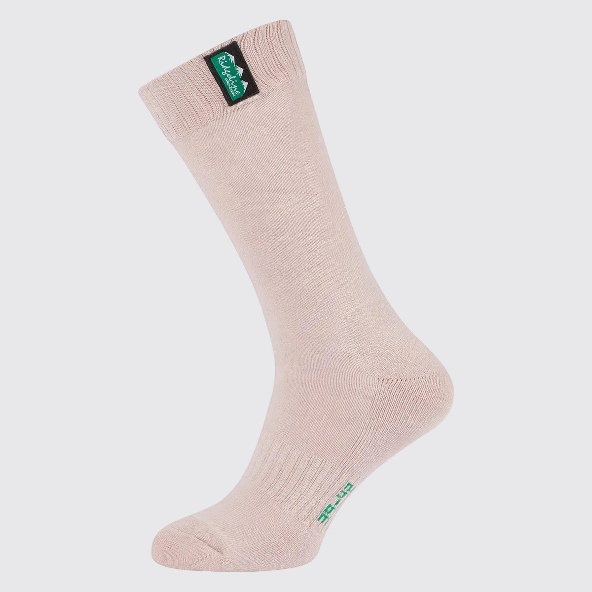 Beige knee-high ribbed sock with green logo tag at cuff, side view