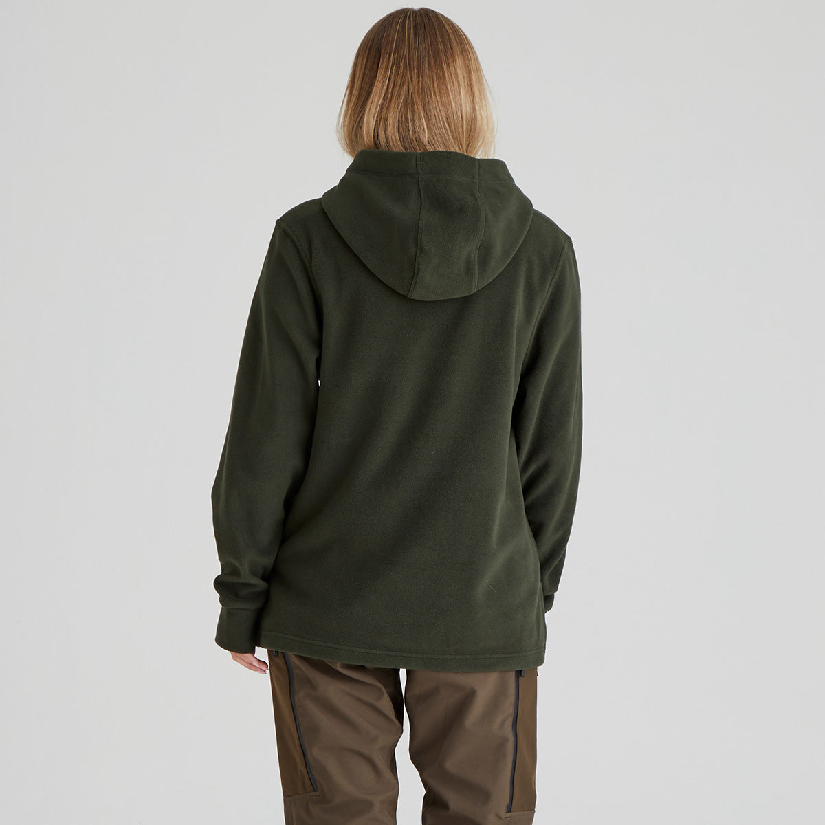 back view of person wearing a green hooded fleece on a plain background