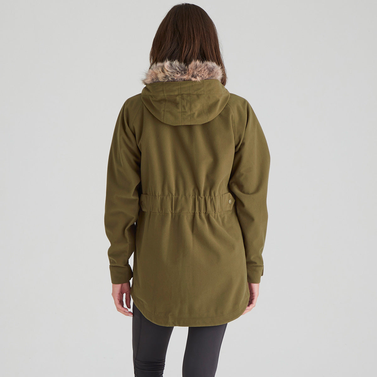 Person wearing a green parka with fur-lined hood on a white background
