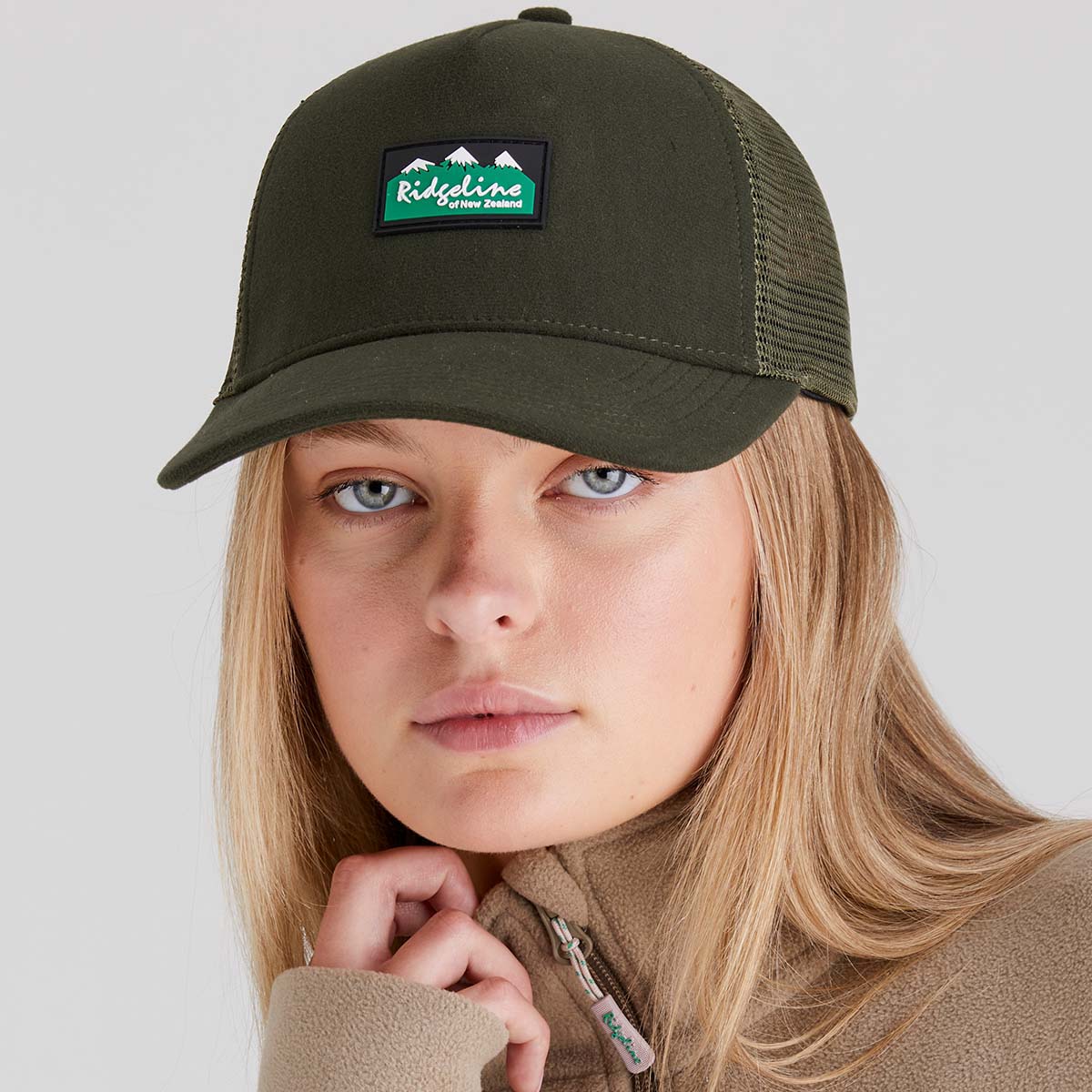 Woman wearing Green hat with Ridgeline Clothing Logo