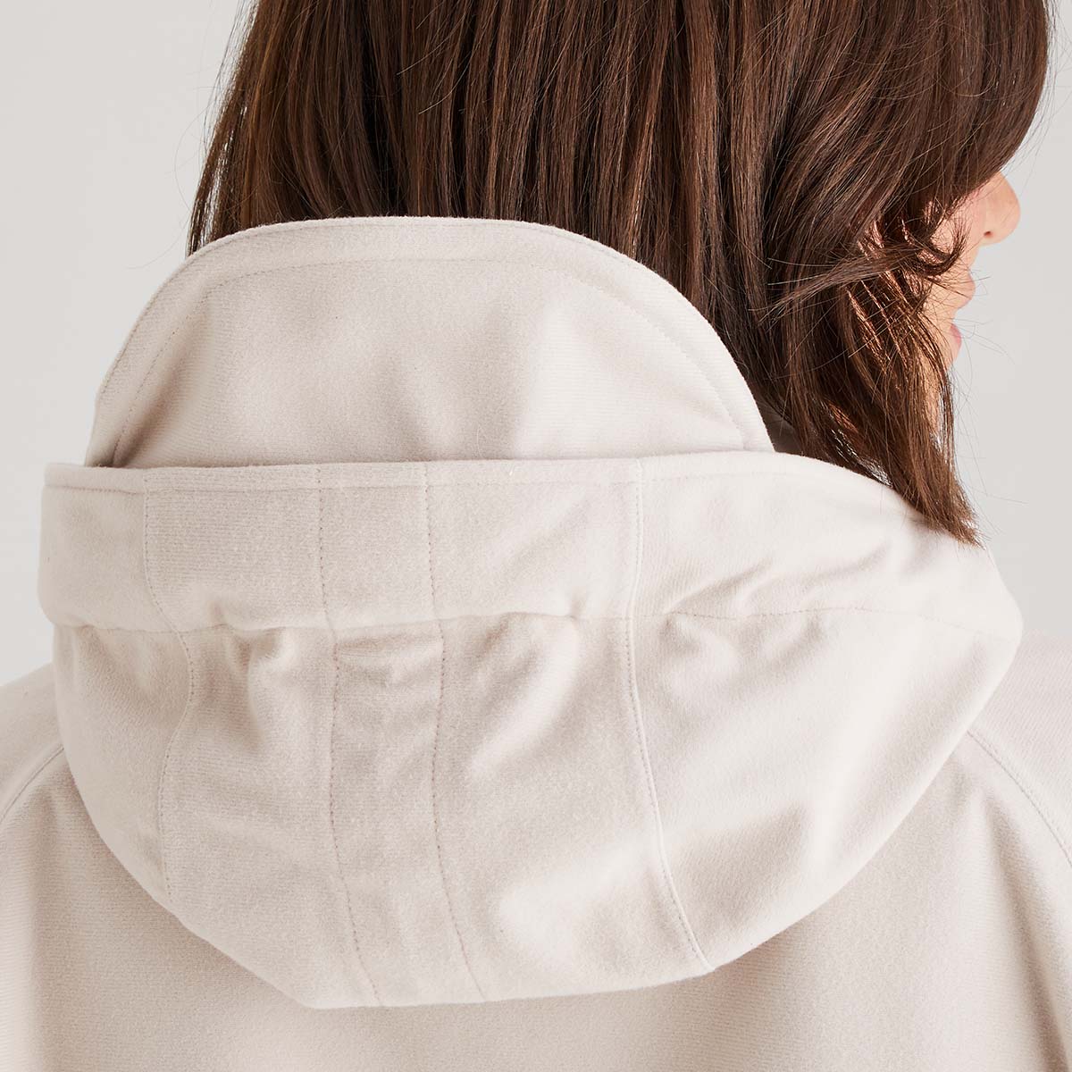 Close-up of a cream hood on a light background