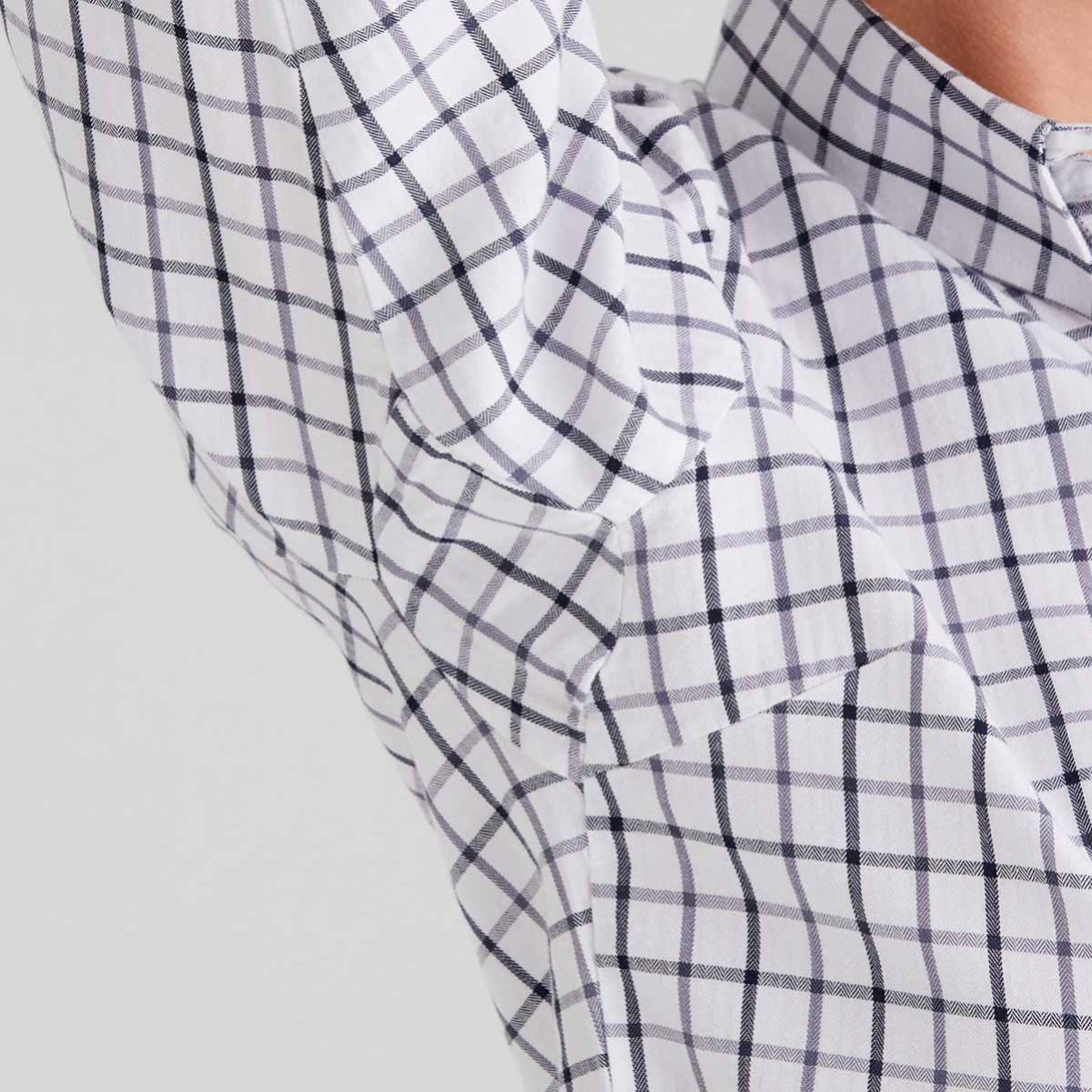Close-up of a checkered shirt with a white background