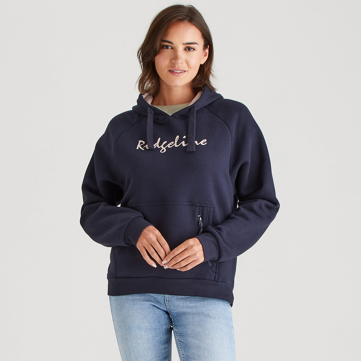 Woman wearing a navy hoodie with 'Ridgeline' text on a light gray background
