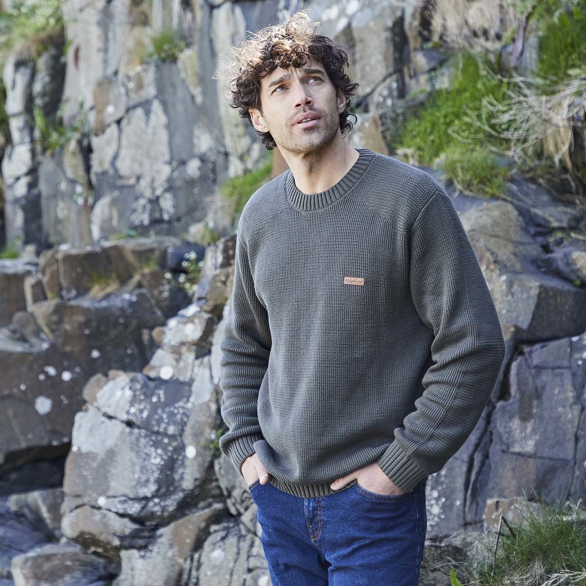 Green crew neck knit jumper with ribbed cuffs and hem, worn outdoor model view