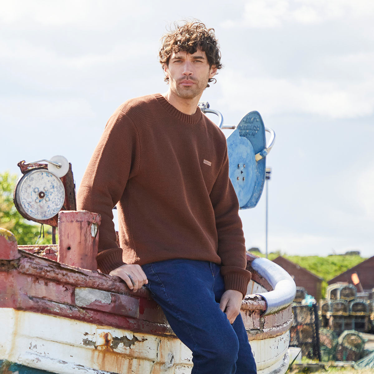 Brown crew neck knit jumper with ribbed cuffs and hem, worn outdoor model view