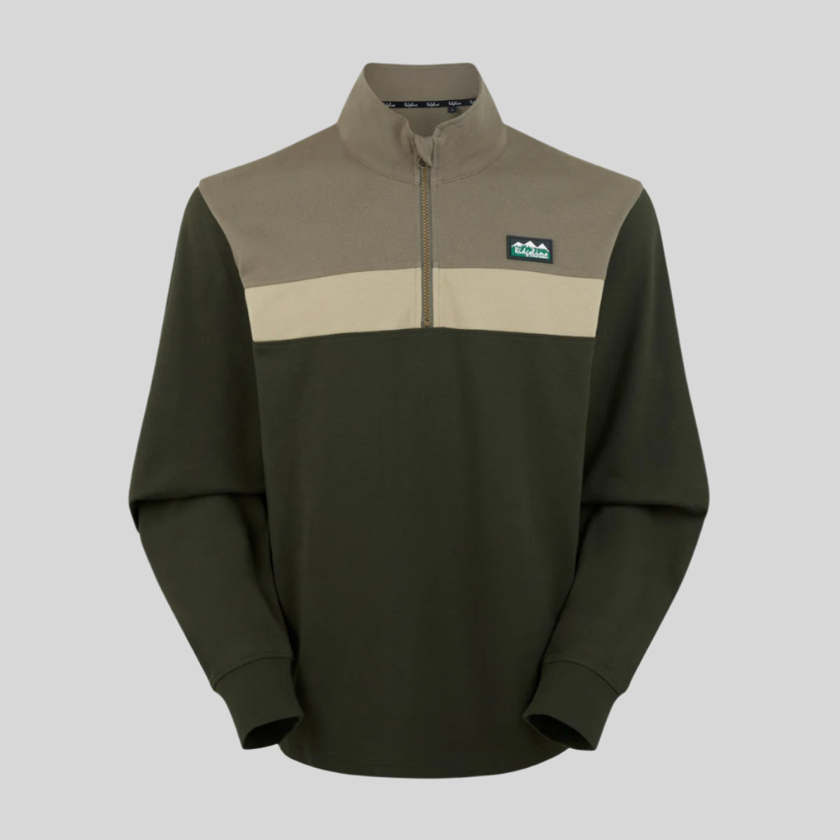 A green/ cream & beige rugby top with a 1/4 zip front, featuring a colour block design with Ridgeline Clothing Logo on chest. On a white background