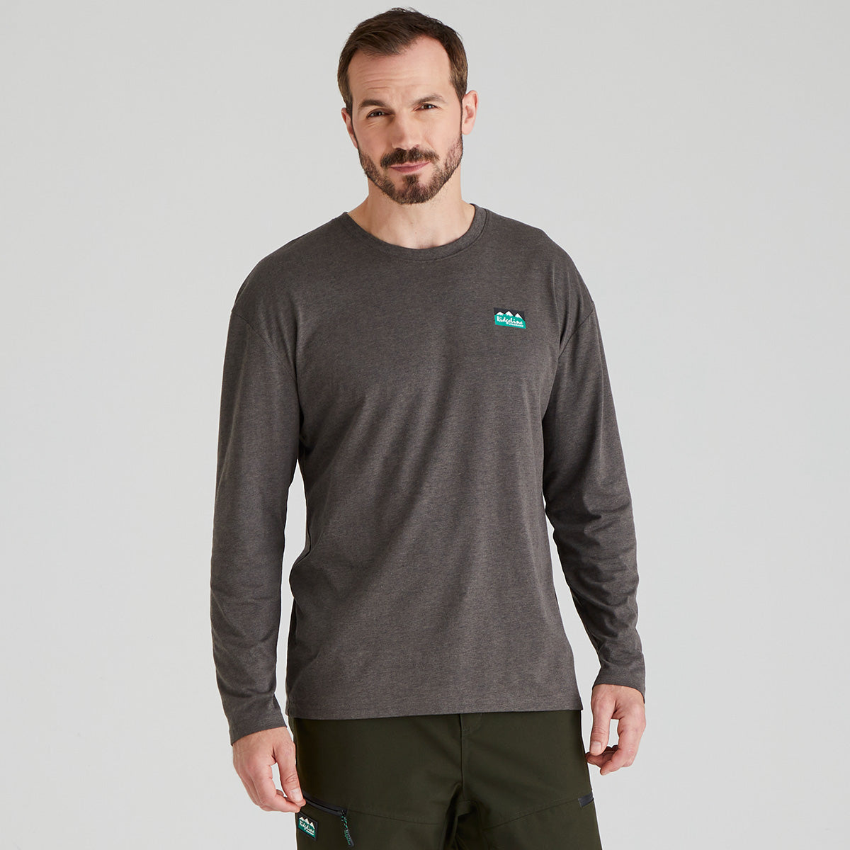 Man wearing a dark grey long-sleeve shirt with a Ridgeline Clothing logo on a light grey background