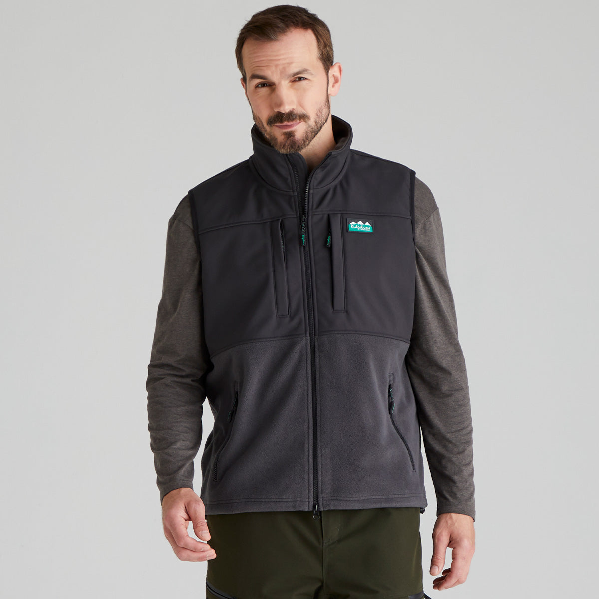 Man wearing a black and grey jacket with a Ridgeline Clothing brand logo on a grey background