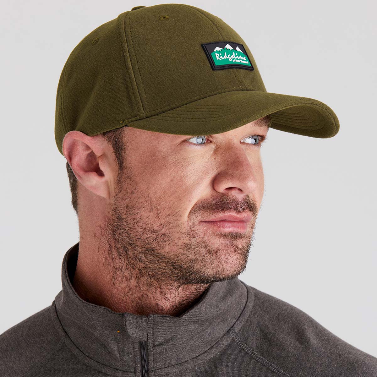 man wearing brown hat with a beard