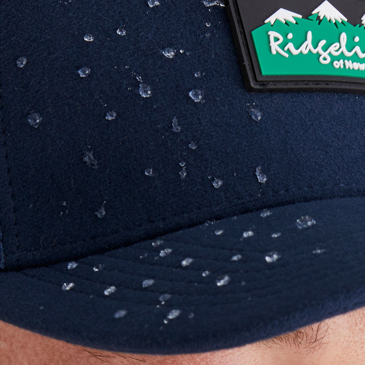Close up showing water resistance fabric & how water rolls off