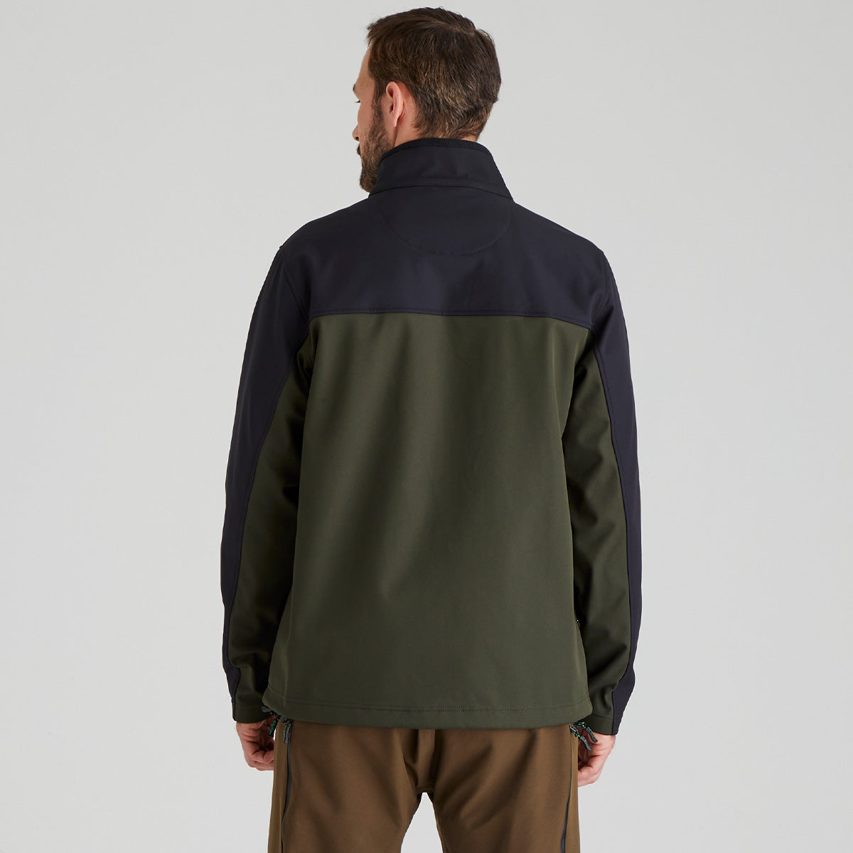back view of Man wearing a two-tone jacket with navy and green colours on a plain background