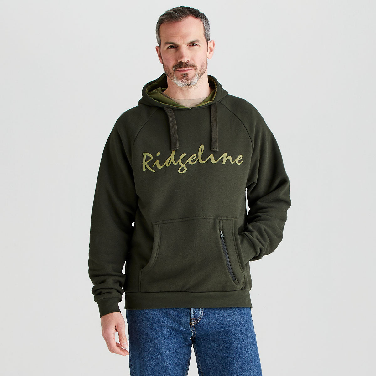 Man wearing a green hoodie with 'Ridgeline' branding on a light gray background