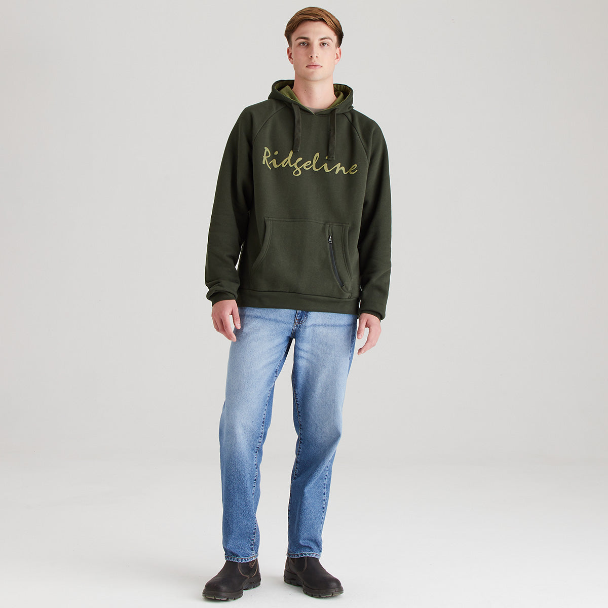 Person wearing a green hoodie with 'Ridgeline' logo and blue jeans on a white background