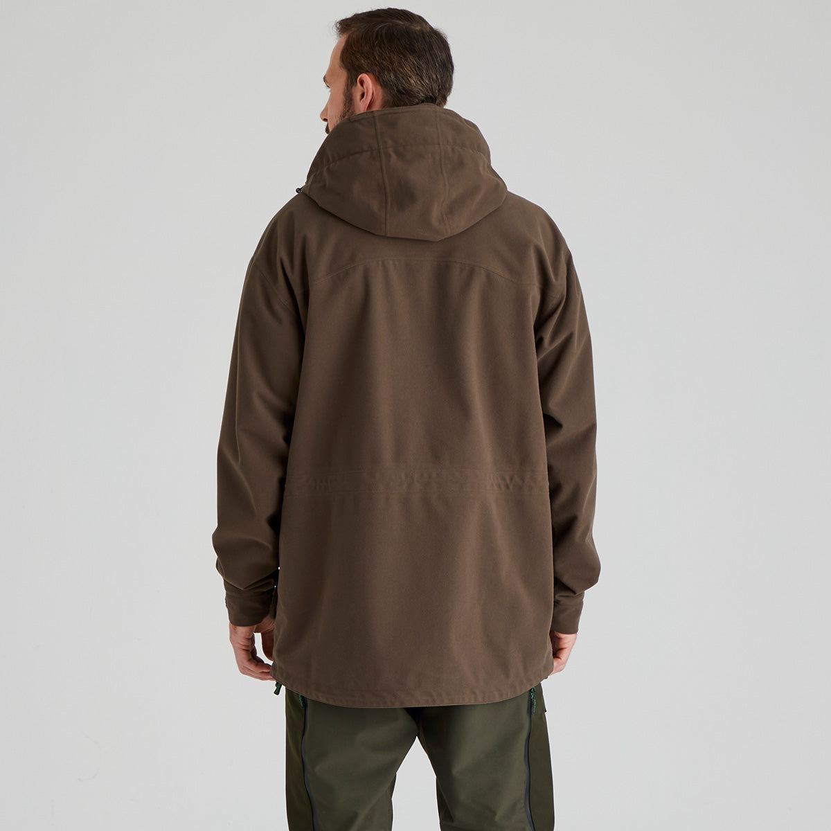 back view of man wearing a brown jacket on a plain background
