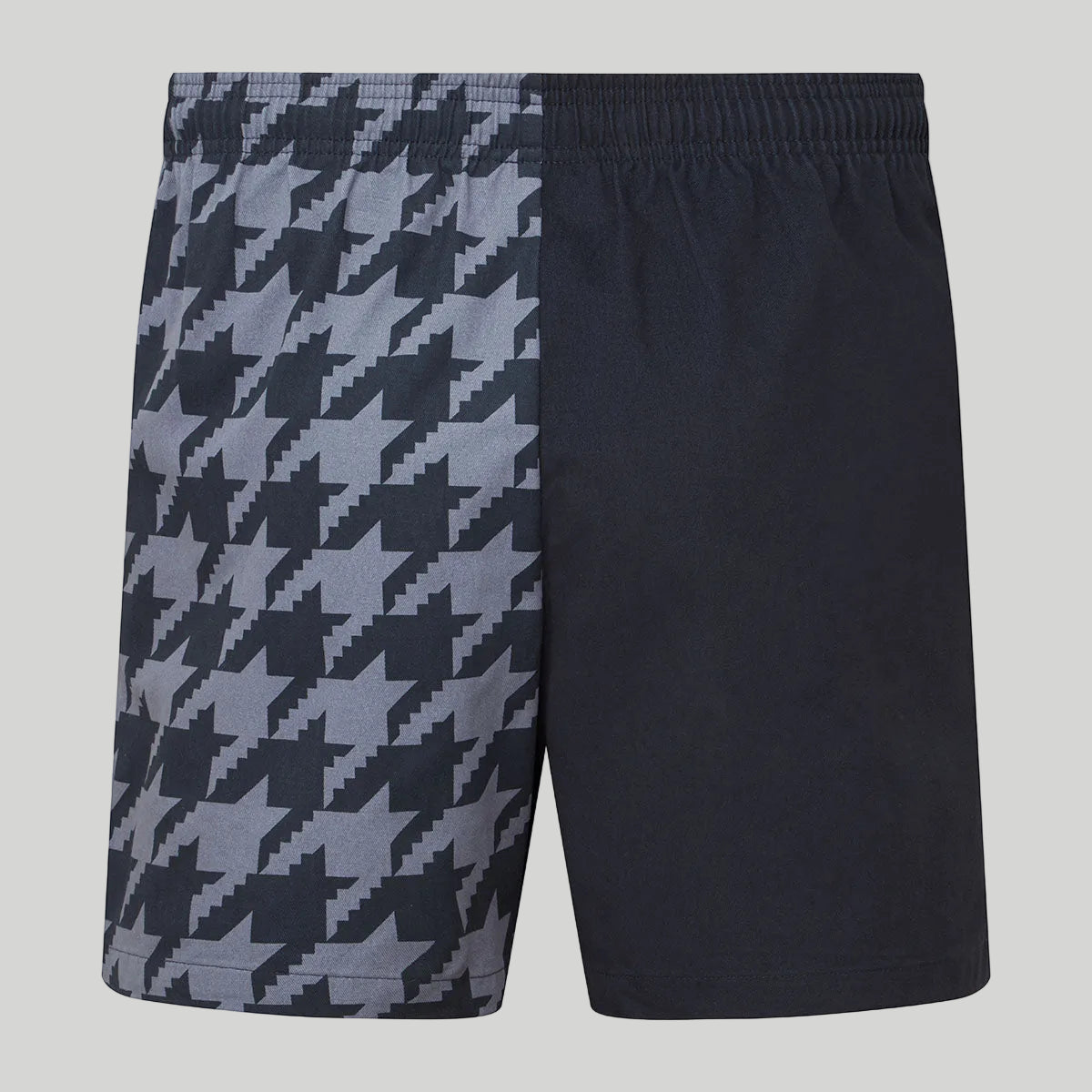 Black and gray houndstooth patterned shorts on a white background