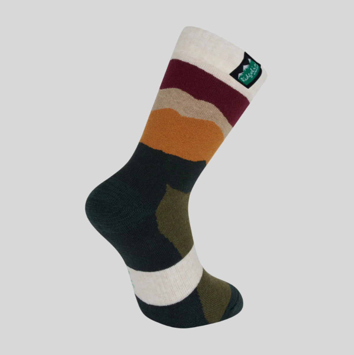 A mid-length merino wool sock with a striped pattern in multiple colours, including green, beige, and red, featuring a brand tag on the cuff. with a white background 