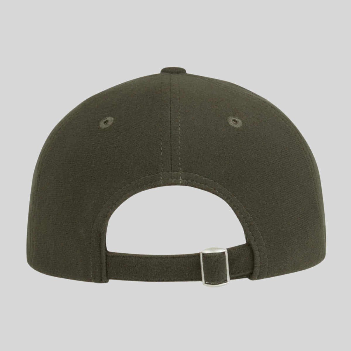 back view of a green Monsoon Classic Cap with an adjustable back and a curved peak, with a white background