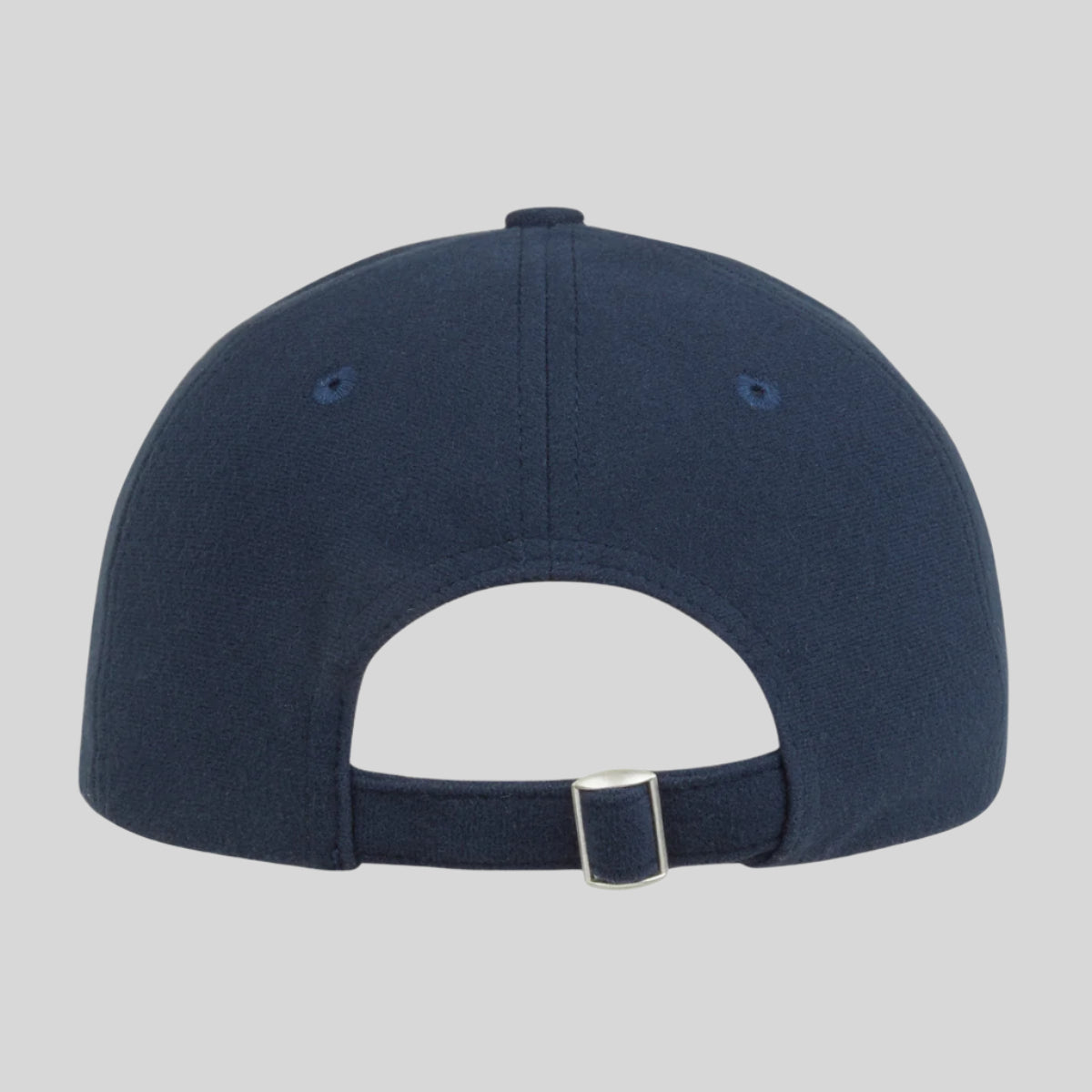 back view of a Navy Ridgeline baseball cap with a curved peak and an adjustable back. on a white background