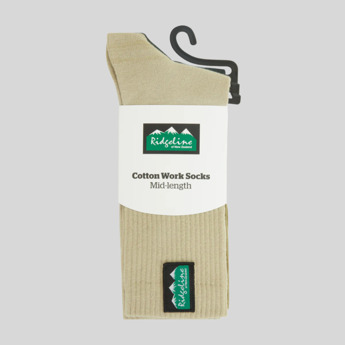 Beige cotton work socks on a hanger with Ridgeline branding.