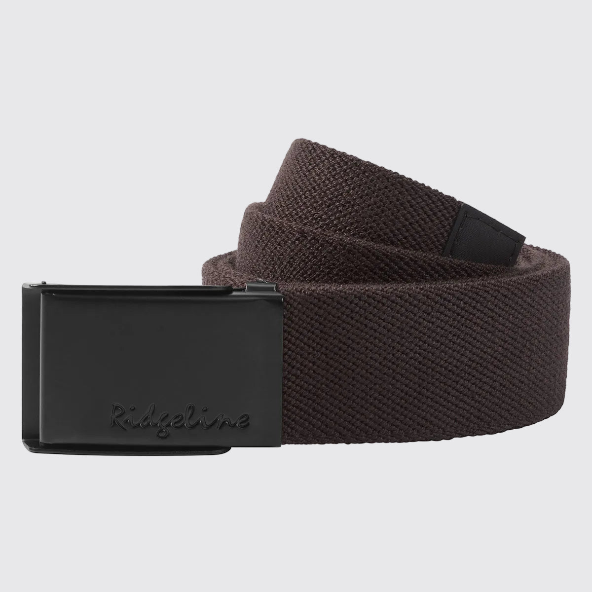 Brown woven fabric belt with Ridgeline‑engraved black plaque buckle, coiled front view